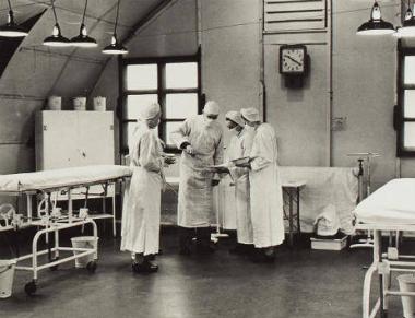 A surgical team in the Nissen hut operating room at 77th/231st Station Hospital, Morley, Wymondham. (Digital archive reference MC 376/591)